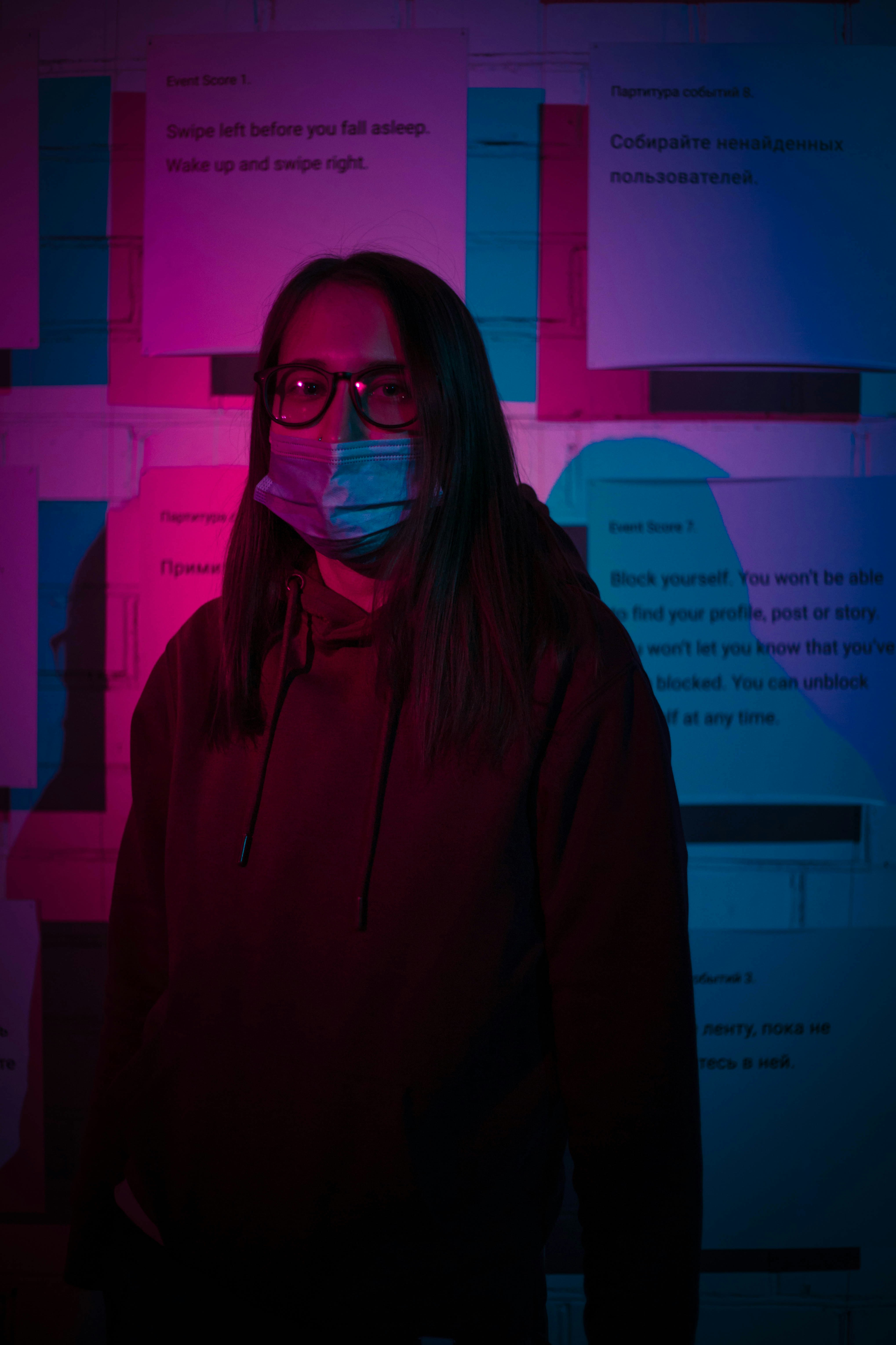 woman in black hoodie wearing black framed eyeglasses