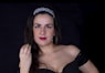woman in black spaghetti strap top with green lipstick