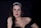 woman in black spaghetti strap top with green lipstick