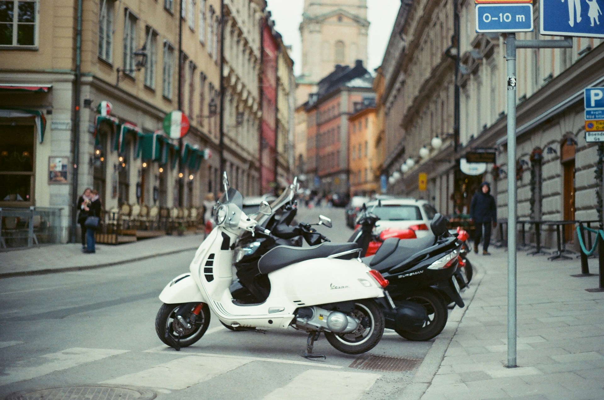 woman wearing yellow long-sleeved dress under white clouds and blue sky during daytime