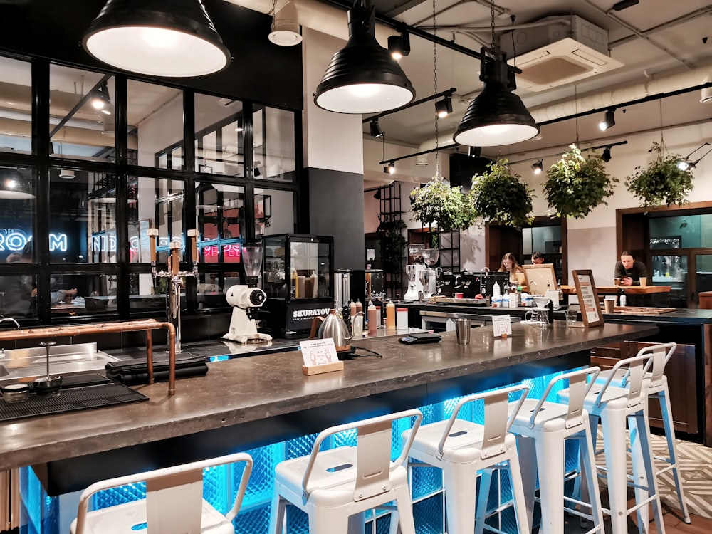 brown wooden table with blue chairs