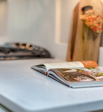 white book on blue table