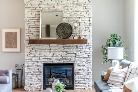 black fireplace in brown brick wall