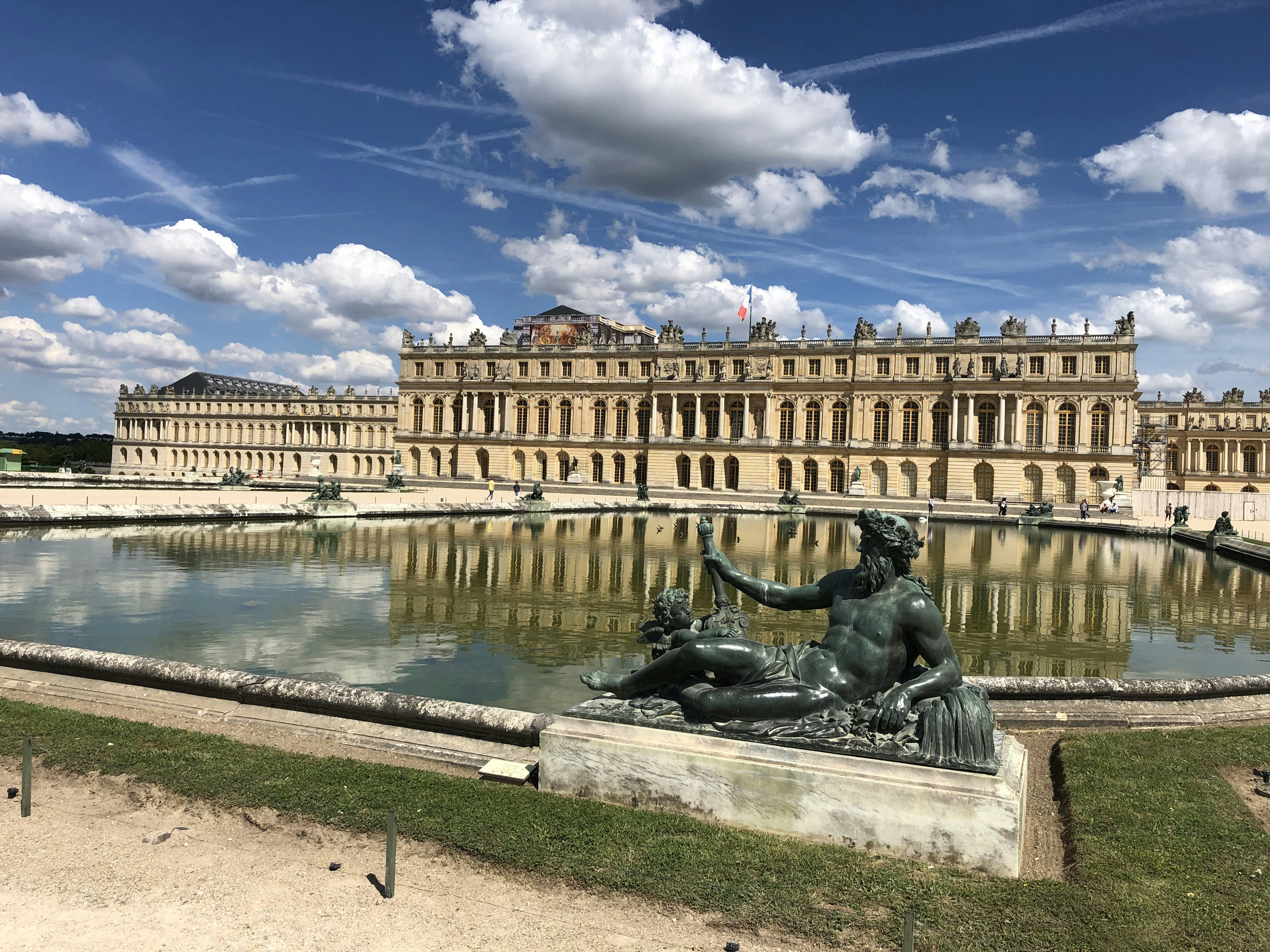 black statue near body of water during daytime, Fountain view from the Versailles Gardens</p><p>Summer 2019