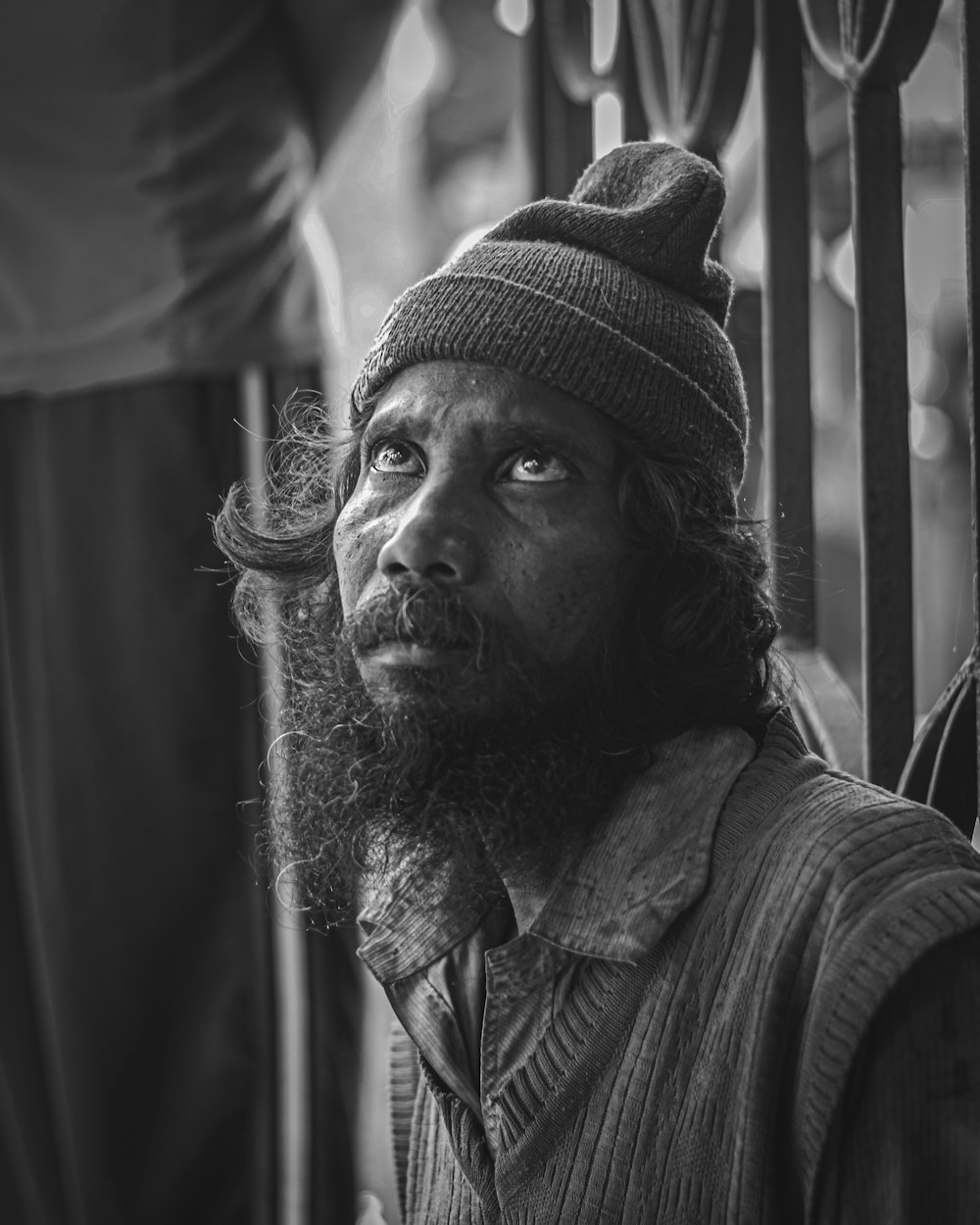 a black and white photo of a man with a beard