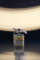 silver and black lighter with white light