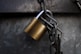 brass padlock on grey metal chain