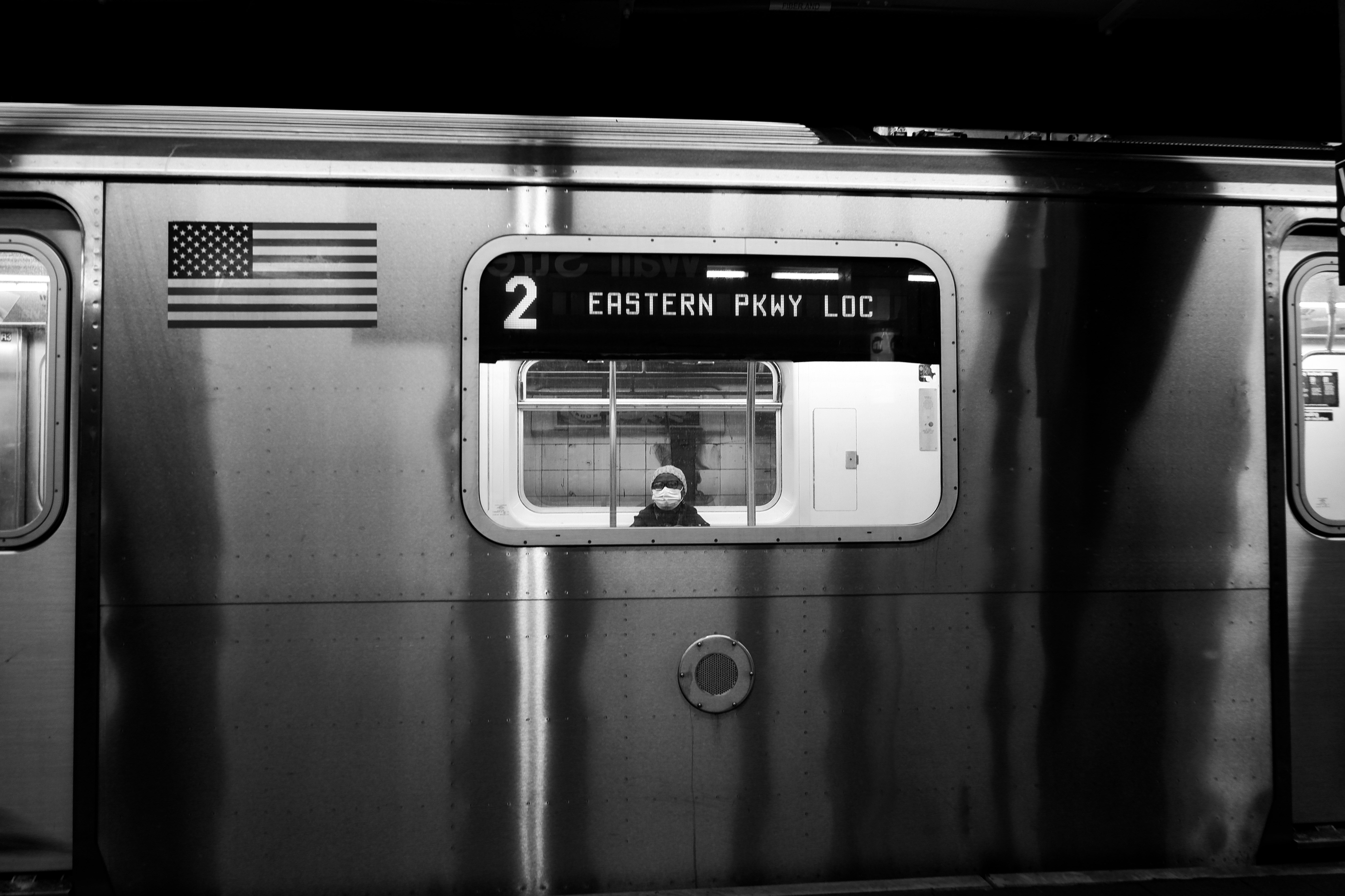 gray scale photo of a train