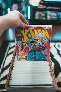 person holding dragon ball z comic book
