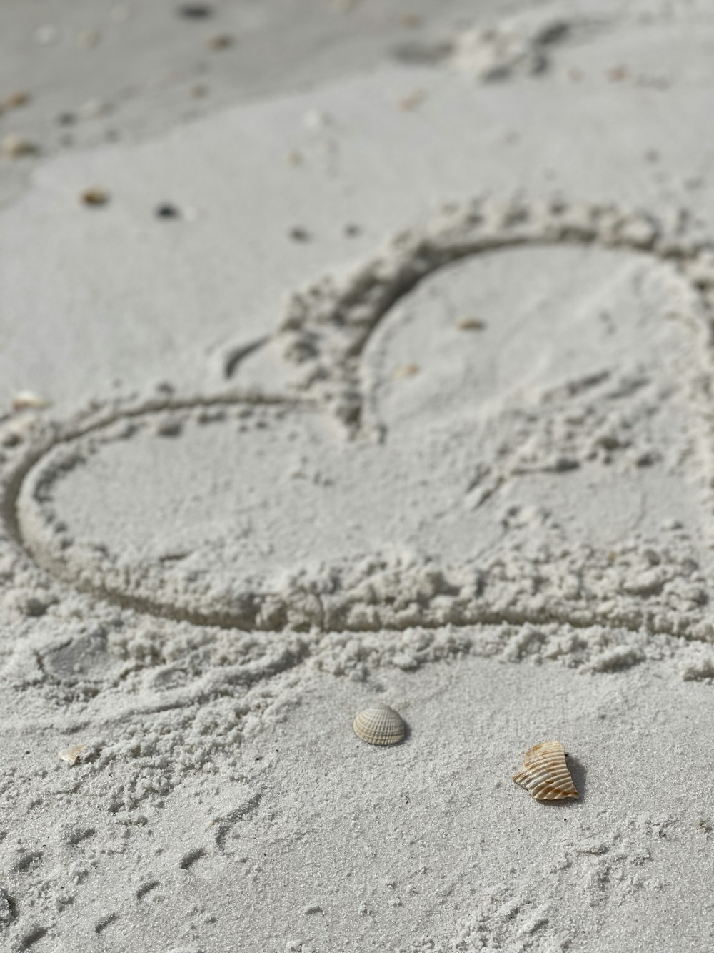 gold necklace on gray sand