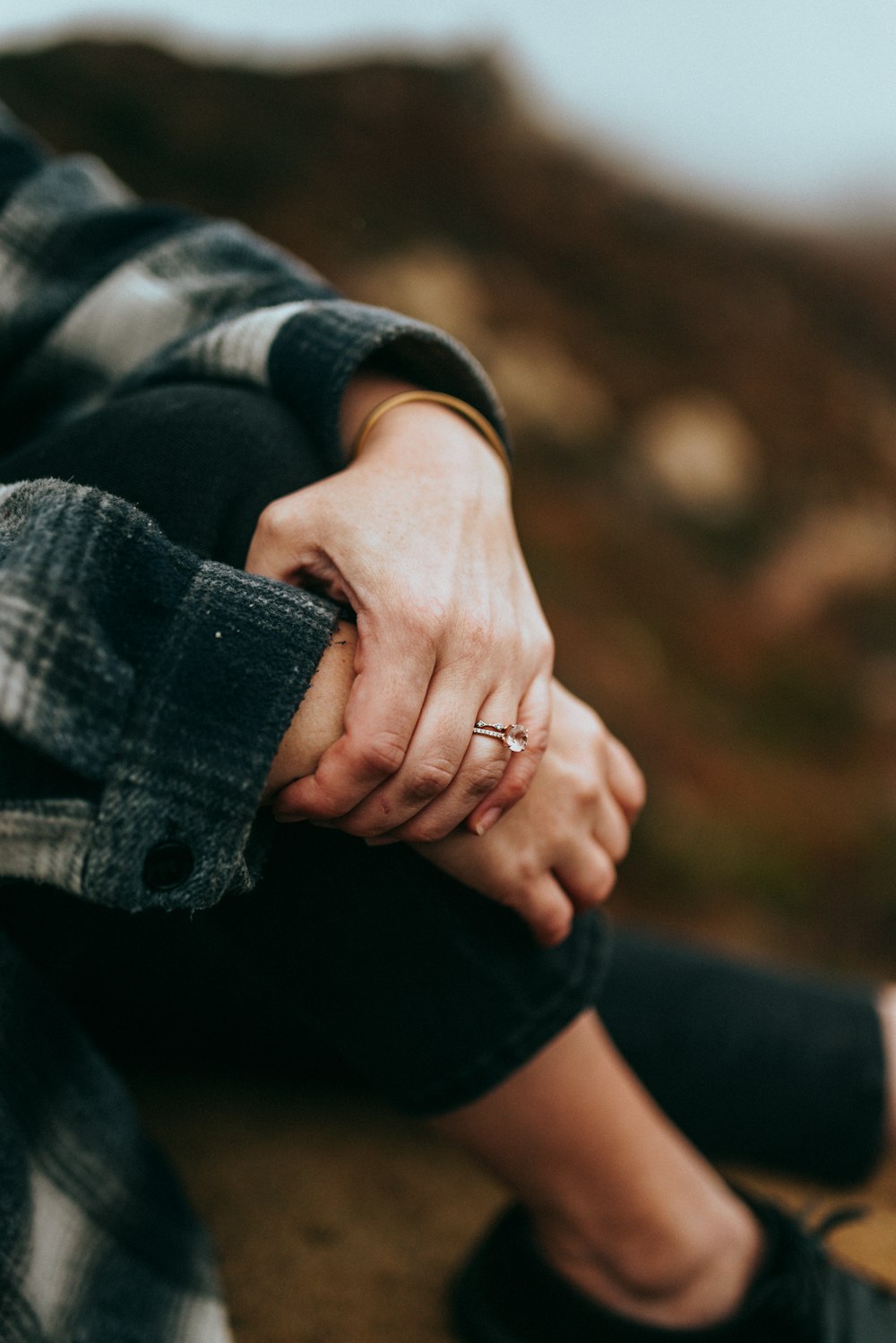 person in blue denim jacket and black denim jeans