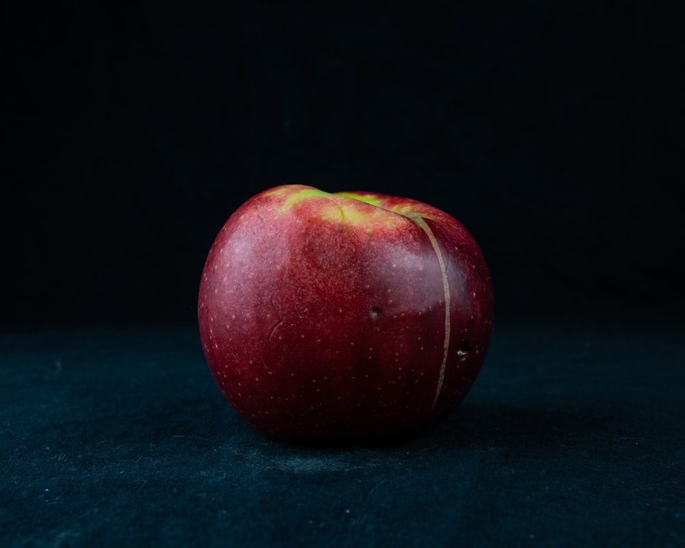 red apple on green textile