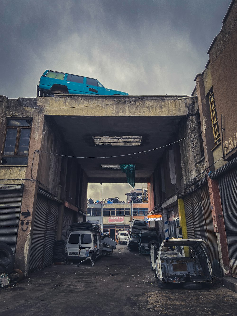 cars parked in front of brown building