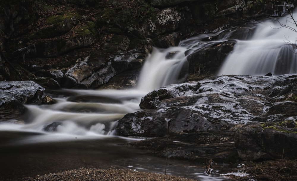 water falls on brown rocky ground