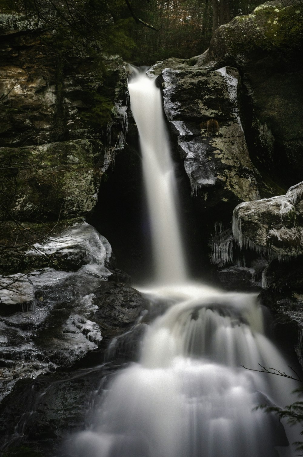 water falls on rocky mountain