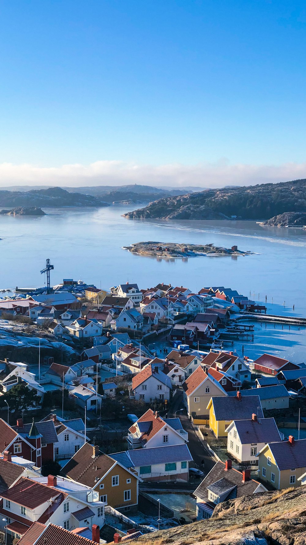 houses near body of water during daytime