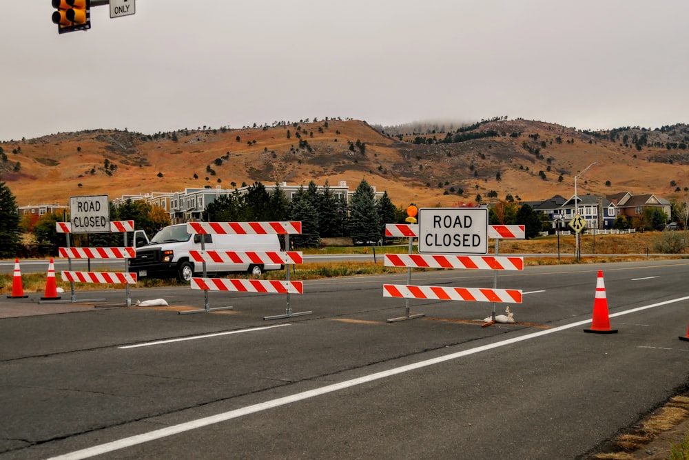 red and white flag on road during daytime