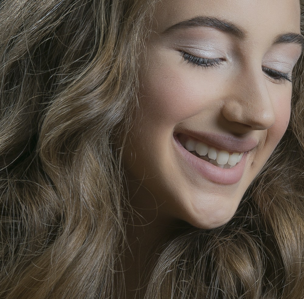 woman with brown hair smiling