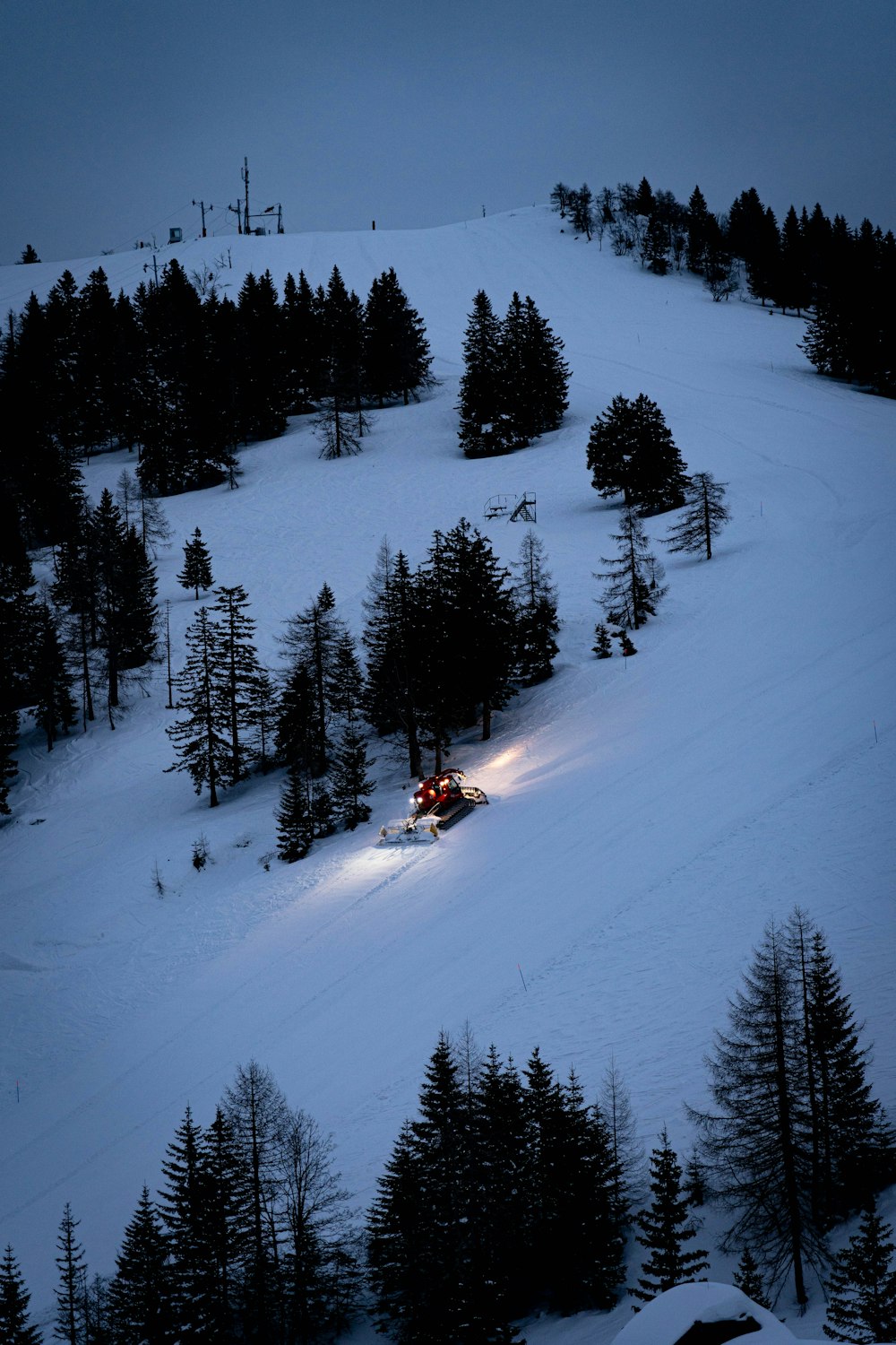 people riding on snow ski lift during daytime
