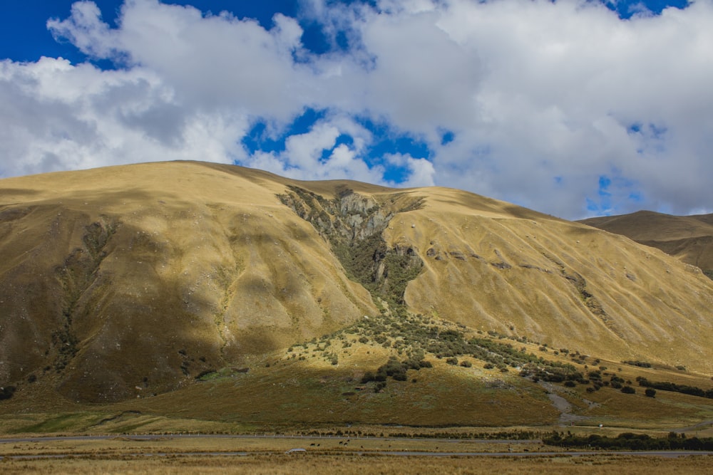 brown and white mountain under blue sky during daytime