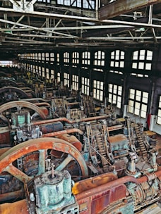 Interior of a spacious industrial workshop with machinery.