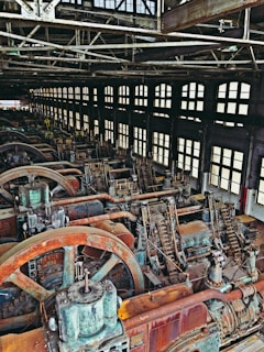 Interior of a spacious industrial workshop with machinery.