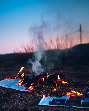 fire on black fire pit during daytime
