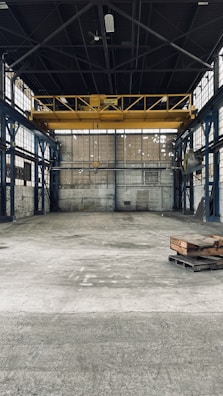 Industrial warehouse transformation with polished concrete floors and high ceilings.