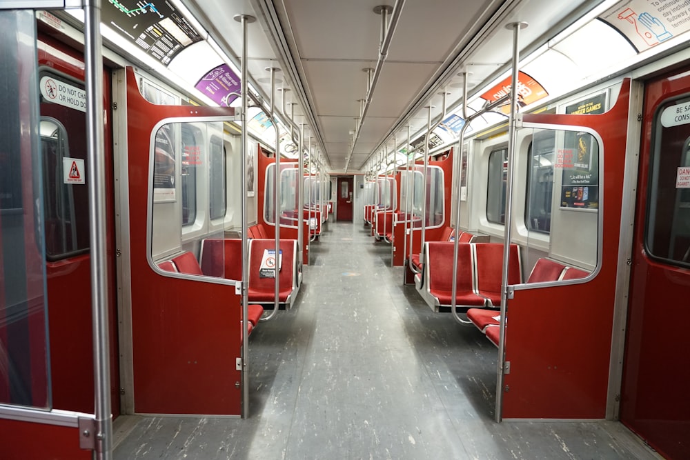 red and white train in train station