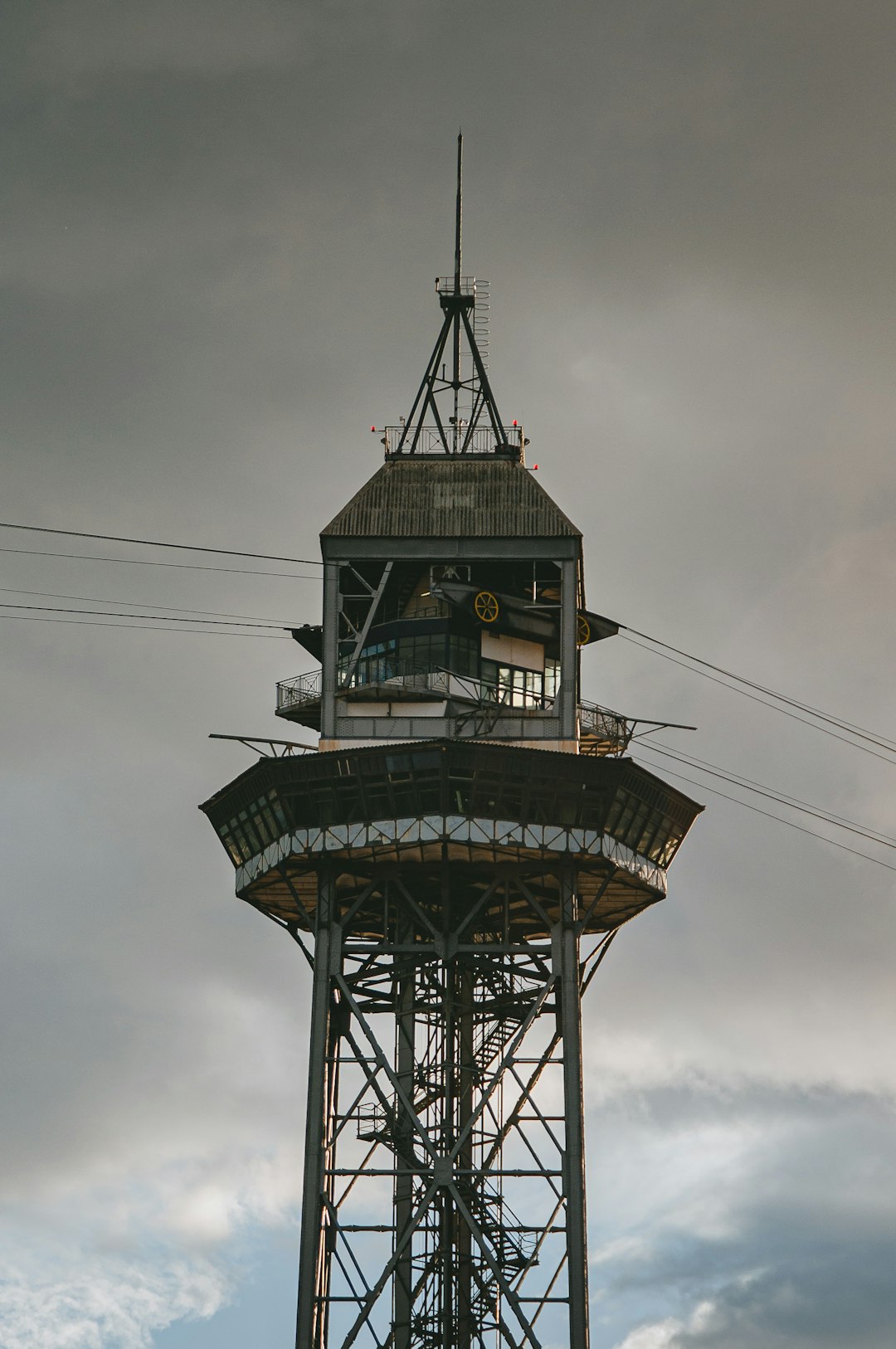 brown wooden tower under cloudy sky