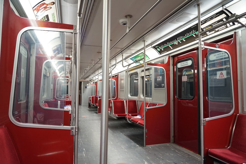 red and white train in train station