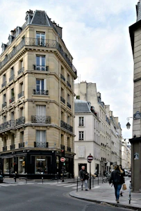 Neighborhood street corner with Heather and W 29th, showing boutique townhomes and bike storage.