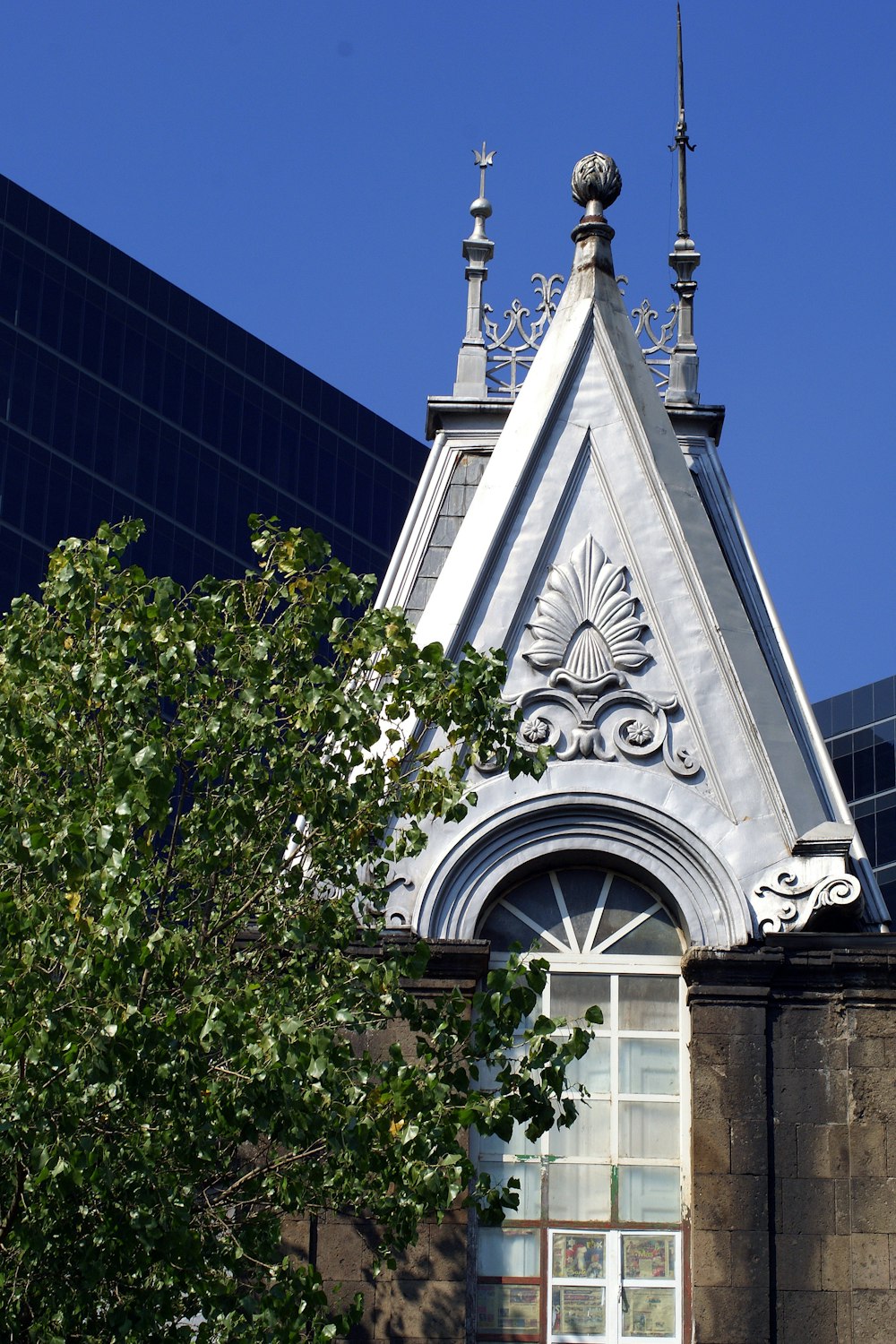 a tall building with a clock on the top of it