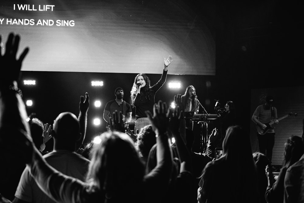 grayscale photo of people gathering in concert