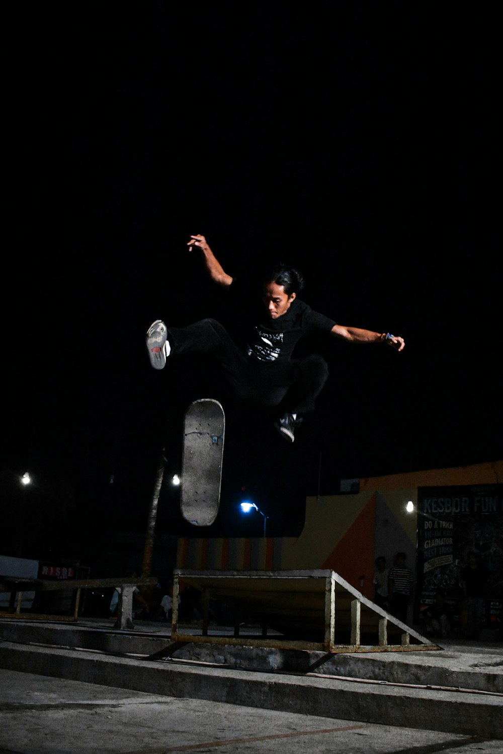 man in black shirt sitting on black chair during nighttime