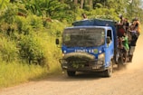 A Velocicarga truck crossing a border checkpoint with customs officials.