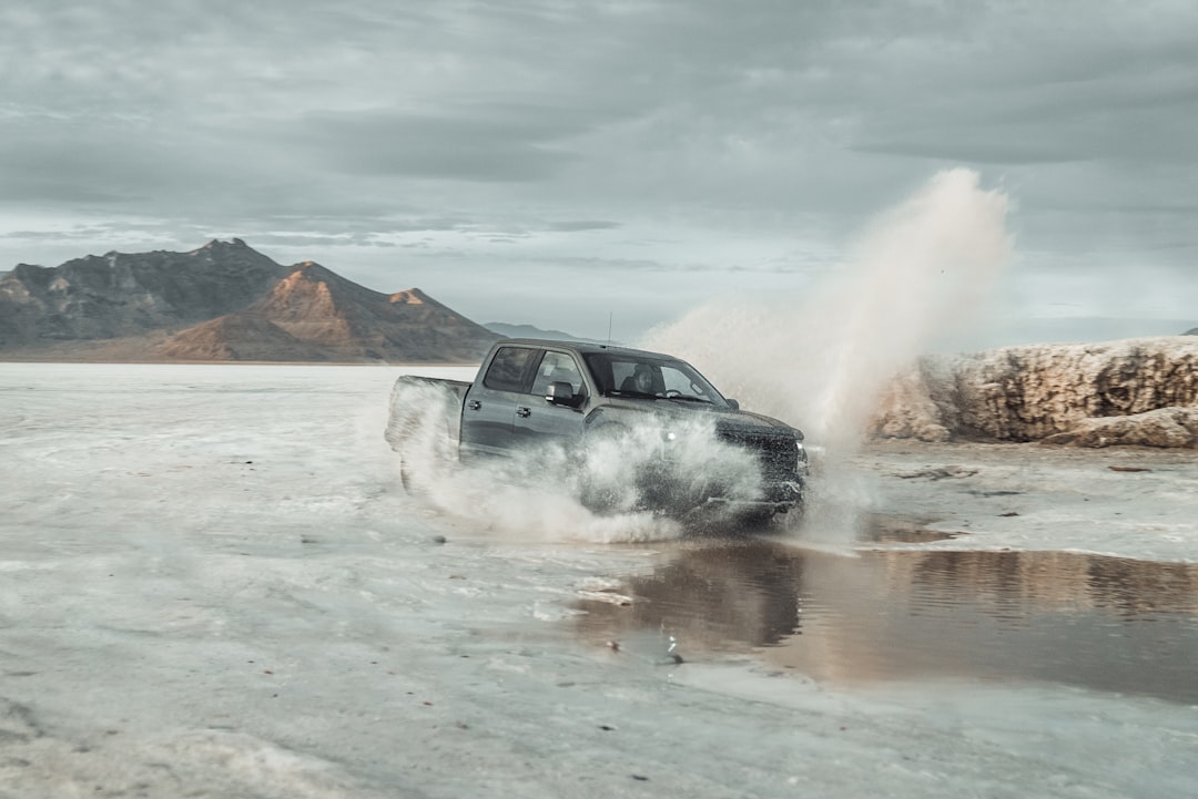 white suv on gray sand during daytime,