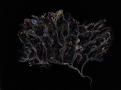 An abstract, intricate pattern resembling a tree or a neuron on a dark background. The pattern is composed of thin, colorful lines and shapes, giving a sense of motion and fluidity.