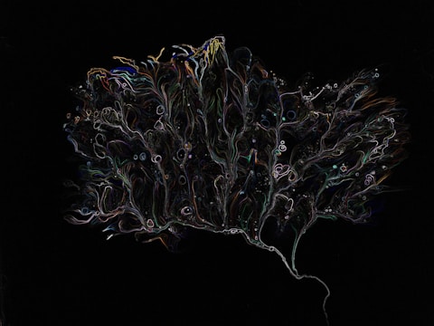 An abstract, intricate pattern resembling a tree or a neuron on a dark background. The pattern is composed of thin, colorful lines and shapes, giving a sense of motion and fluidity.