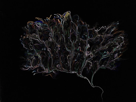 An abstract, intricate pattern resembling a tree or a neuron on a dark background. The pattern is composed of thin, colorful lines and shapes, giving a sense of motion and fluidity.