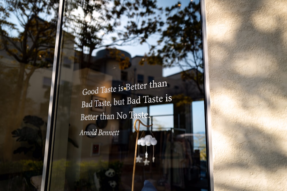 a glass window with a quote written on it