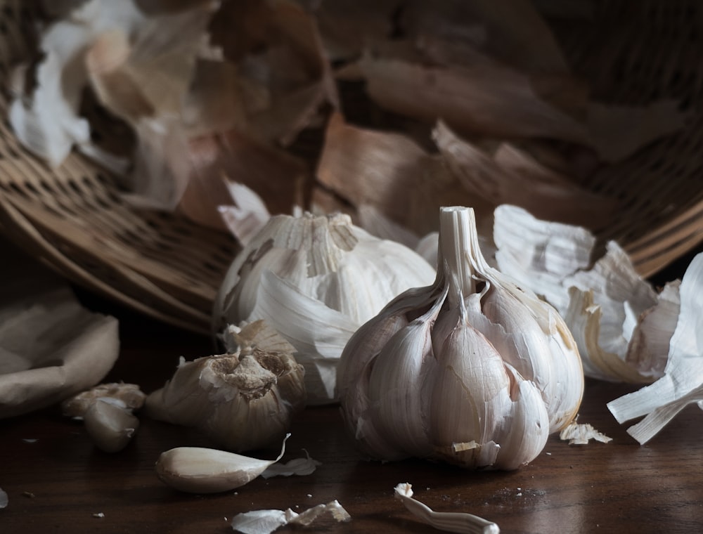 white garlic on brown wooden table