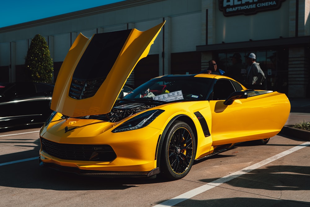 yellow ferrari 458 italia parked near white building