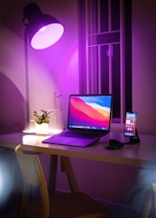 black and silver laptop computer on white table