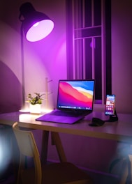 black and silver laptop computer on white table