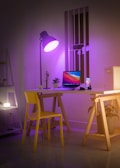The purple GaN charger glowing softly on a modern office desk with tech accessories.