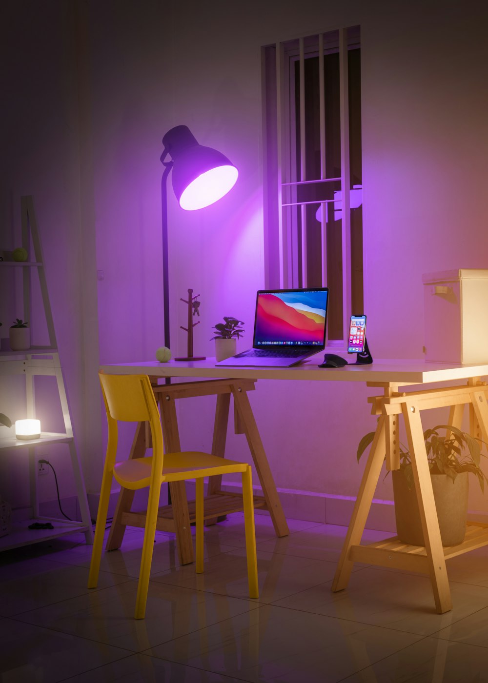 black laptop computer on white wooden table