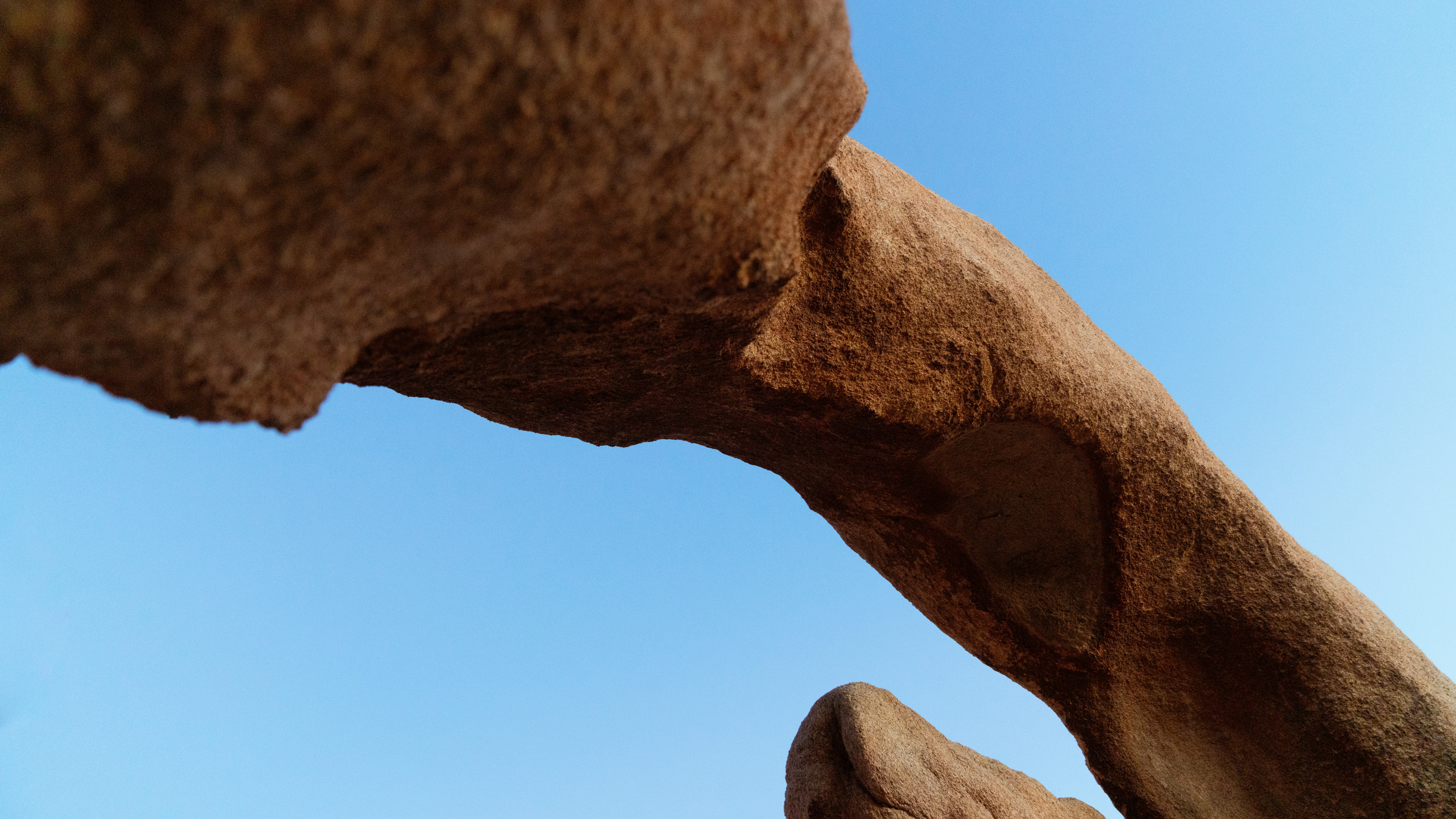 brown rock formation under blue sky during daytime