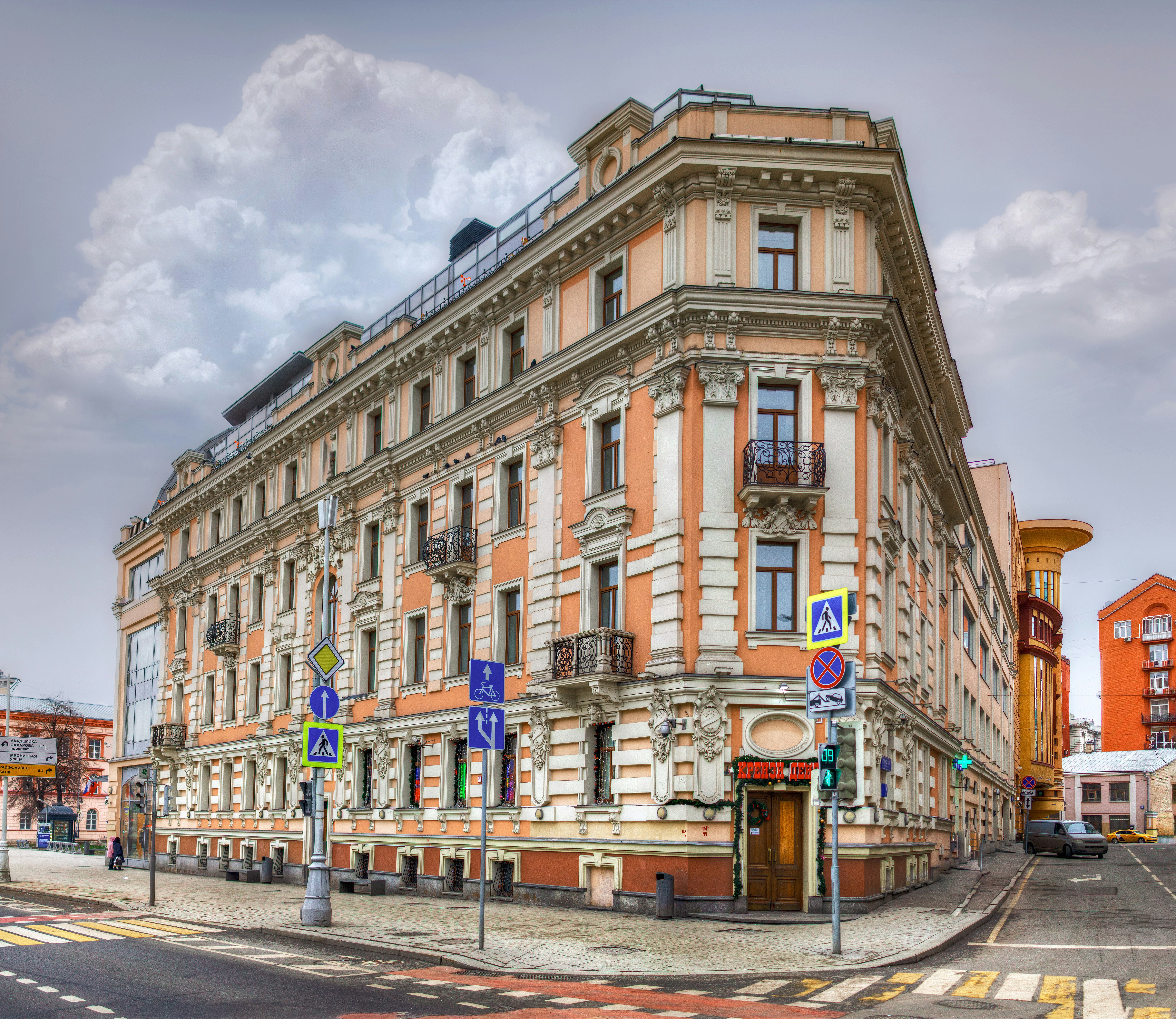 a large building on the corner of a street