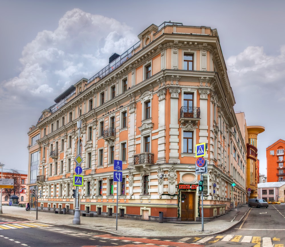 a large building on the corner of a street